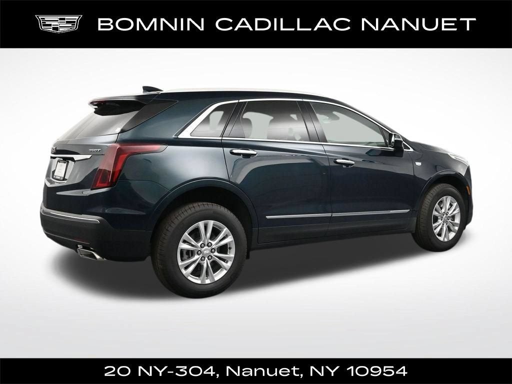 2026 Cadillac XT5 Luxury in Emerald Lake Metallic — front three-quarter view