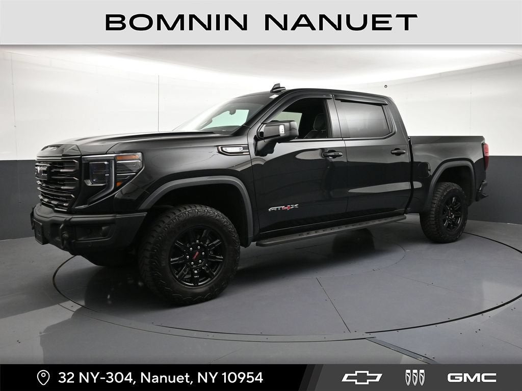 2024 GMC Sierra 1500 AT4X in Onyx Black — front three-quarter view