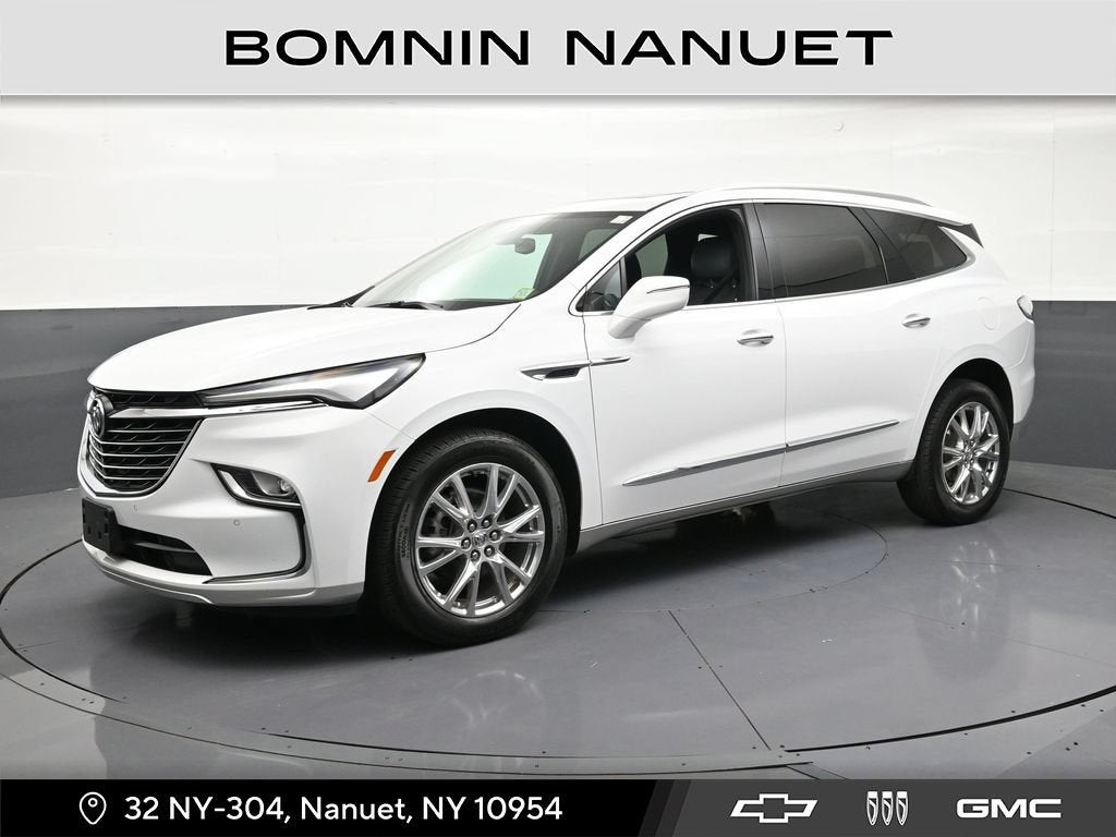 2024 Buick Enclave Essence in Summit White — front three-quarter view